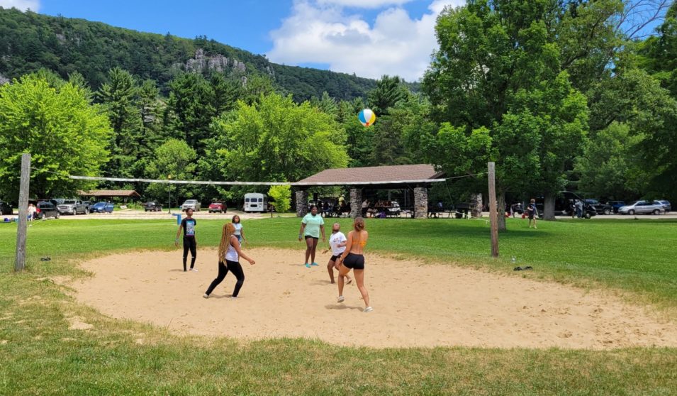 Teens play volleyball at Devils Lake State Park in Wisconsin.