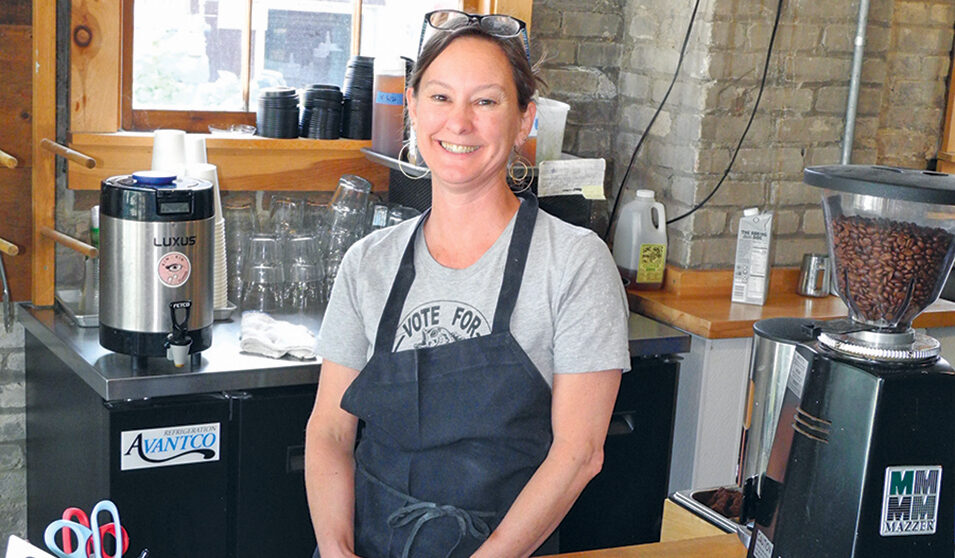 Debbie Buchannan behind the counter at Reverie Baking on Winnebago Street.