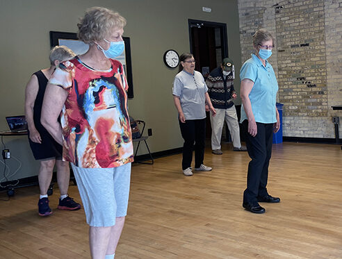 Older adults enjoy the weekly line dancing at Goodman Community Center.