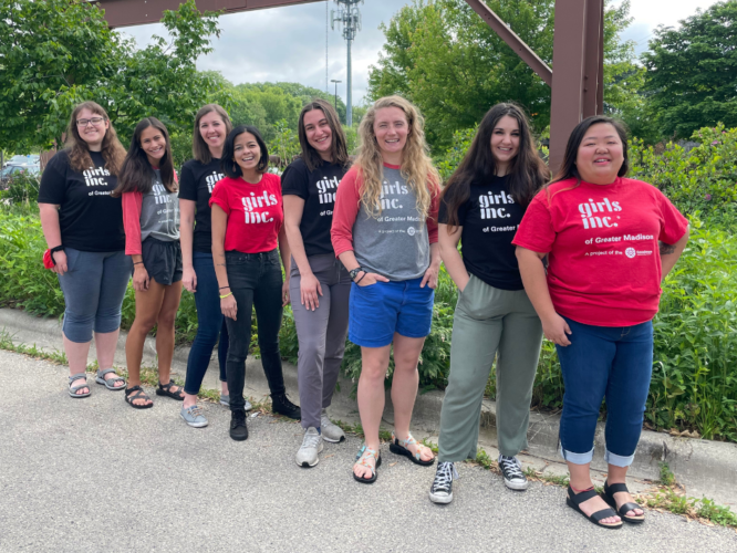 Girls Inc. of Greater Madison summer 2022 staff pose in front of lush greenery.