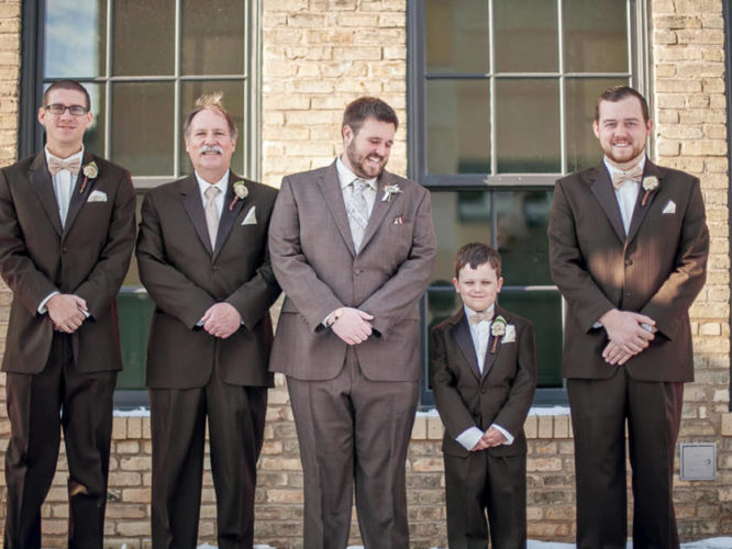 A groom standing with his best men