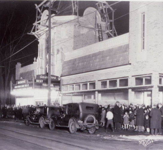 A historical photo of a crowd gathered outside of the Barrymore Theater