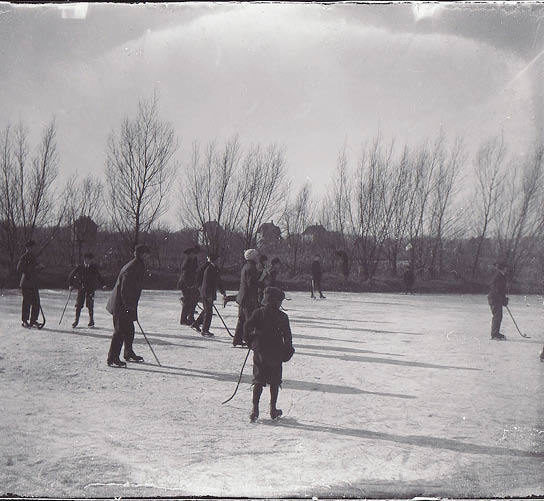 A historical photo of people ice skating at Tenney Park