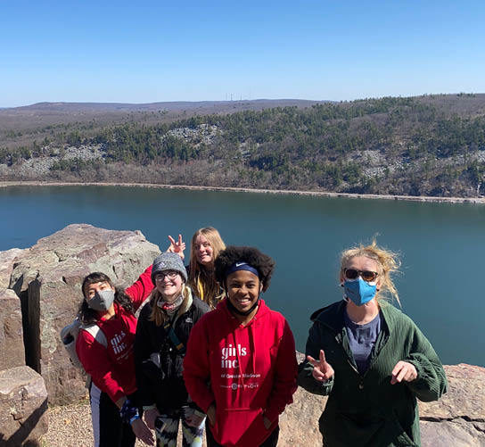 Girls posing on top of the bluff at Devil's Lake