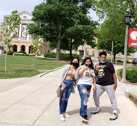 Three students pose on the UW Madison campus.